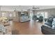 Open living room with comfortable seating and hardwood floors at 1716 Quail Hill Dr, Lakeland, FL 33810