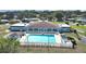 Community pool with surrounding lounge chairs at 1716 Quail Hill Dr, Lakeland, FL 33810