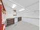 Bright workshop with built-in shelving and pegboard at 1716 Quail Hill Dr, Lakeland, FL 33810