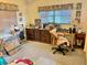 Bright bedroom with dresser, desk, and chair at 1865 4Th Se St, Winter Haven, FL 33880