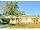 Ranch-style home with carport and spacious yard at 1865 4Th Se St, Winter Haven, FL 33880
