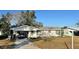 House exterior featuring a driveway and front yard at 1865 4Th Se St, Winter Haven, FL 33880
