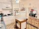 Galley kitchen with white cabinets and appliances at 1865 4Th Se St, Winter Haven, FL 33880