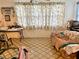 Living room features a couch and patterned tile floor at 1865 4Th Se St, Winter Haven, FL 33880
