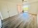 Spacious bedroom with wood-look floors and sliding door to patio at 19 Aspen Dr. # 19, Haines City, FL 33844