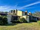Rear view of condo with garage and screened patio at 19 Aspen Dr. # 19, Haines City, FL 33844