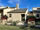 Condo entrance with stone planters and walkway at 19 Aspen Dr. # 19, Haines City, FL 33844