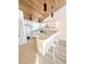 Modern kitchen with white cabinetry and breakfast bar at 19 Aspen Dr. # 19, Haines City, FL 33844