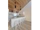 Modern kitchen with white cabinetry and breakfast bar at 19 Aspen Dr. # 19, Haines City, FL 33844