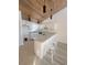 Modern kitchen with white cabinetry and breakfast bar at 19 Aspen Dr. # 19, Haines City, FL 33844