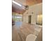 Bright living room featuring high ceilings and wood-look floors at 19 Aspen Dr. # 19, Haines City, FL 33844