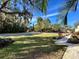 Community walkway with lush landscaping at 19 Aspen Dr. # 19, Haines City, FL 33844