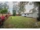 Spacious backyard with grassy lawn and wooden privacy fence at 2104 John Arthur Way, Lakeland, FL 33803