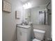 Modern bathroom with granite countertop, white cabinets, and updated fixtures at 2104 John Arthur Way, Lakeland, FL 33803