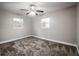Bright bedroom with ceiling fan and carpet at 2104 John Arthur Way, Lakeland, FL 33803