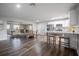 Open concept kitchen and dining area with hardwood floors at 2104 John Arthur Way, Lakeland, FL 33803