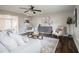 Living area with hardwood floors, comfortable seating, and stylish decor at 2104 John Arthur Way, Lakeland, FL 33803