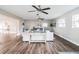 Spacious living room with hardwood floors and ceiling fans at 2104 John Arthur Way, Lakeland, FL 33803