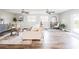 Living room with hardwood floors, sofa, and plenty of natural light at 2104 John Arthur Way, Lakeland, FL 33803
