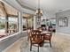 Breakfast nook with a view into the living room and pool area at 221 Mclean Pt, Winter Haven, FL 33884