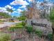 Gated community entrance with a stone sign at 221 Mclean Pt, Winter Haven, FL 33884