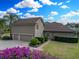 Two car garage and side yard view of home at 221 Mclean Pt, Winter Haven, FL 33884