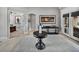 Charming foyer featuring a dark wood accent table with access to multiple living spaces at 221 Mclean Pt, Winter Haven, FL 33884