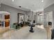 Welcoming foyer with tile flooring, accent chairs and view of the kitchen at 221 Mclean Pt, Winter Haven, FL 33884