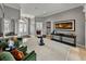 Grand foyer featuring a dark wood accent table, tile floors, and transom windows at 221 Mclean Pt, Winter Haven, FL 33884