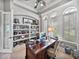 Home office with built-in shelves and a view of the backyard at 221 Mclean Pt, Winter Haven, FL 33884
