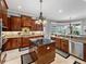 Gourmet kitchen with granite counters, stainless steel appliances, and bay window view at 221 Mclean Pt, Winter Haven, FL 33884