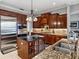 Modern kitchen with stainless steel appliances, custom cabinets, granite countertops, and an island at 221 Mclean Pt, Winter Haven, FL 33884