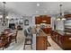 Gourmet kitchen boasts dark wood cabinets, granite counters and island at 221 Mclean Pt, Winter Haven, FL 33884