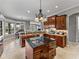 Bright kitchen with a central island, granite counters, and stainless steel appliances at 221 Mclean Pt, Winter Haven, FL 33884