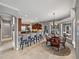 Open kitchen and dining area with breakfast bar, table, and natural light from windows at 221 Mclean Pt, Winter Haven, FL 33884