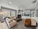 Inviting living room with a fireplace, built-in shelving, and plush seating at 221 Mclean Pt, Winter Haven, FL 33884
