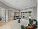 Living room featuring a rug, table and chairs, with views to the backyard at 221 Mclean Pt, Winter Haven, FL 33884