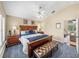 Cozy bedroom offers comfortable king bed, bedside tables, and sitting bench at 221 Mclean Pt, Winter Haven, FL 33884
