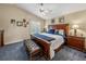 Cozy bedroom offers comfortable king bed, bedside tables, and lots of natural light at 221 Mclean Pt, Winter Haven, FL 33884