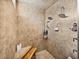 A tiled shower with dual showerheads and a built-in bench and niche at 221 Mclean Pt, Winter Haven, FL 33884