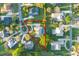 Aerial view of property featuring screened pool, mature landscaping and circular driveway on a cul-de-sac street at 2428 Wildwood Ct, Winter Haven, FL 33884