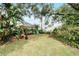 Relaxing backyard oasis with pergola and swing at 2428 Wildwood Ct, Winter Haven, FL 33884