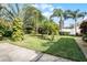 Landscaped backyard with lush tropical plants at 2428 Wildwood Ct, Winter Haven, FL 33884