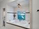 Relaxing bathroom with soaking tub, stained glass window, and tile flooring at 2428 Wildwood Ct, Winter Haven, FL 33884
