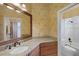 Elegant bathroom with granite vanity, large mirror, and updated fixtures at 2428 Wildwood Ct, Winter Haven, FL 33884