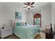 Bright bedroom with window seat, ceiling fan, and plenty of natural light at 2428 Wildwood Ct, Winter Haven, FL 33884