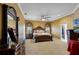 Spacious Primary bedroom with ornate furniture and neutral carpeting at 2428 Wildwood Ct, Winter Haven, FL 33884