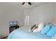 Spacious bedroom with large bed, ceiling fan, and TV at 2428 Wildwood Ct, Winter Haven, FL 33884