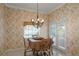 Charming breakfast nook with a view of the pool and French doors at 2428 Wildwood Ct, Winter Haven, FL 33884
