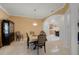Formal dining room with a chandelier, wood table and chairs, and built-in hutch at 2428 Wildwood Ct, Winter Haven, FL 33884